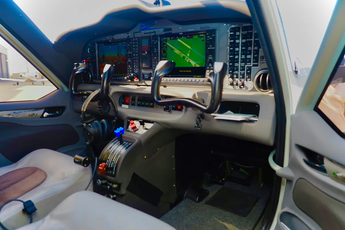 Turboprop cockpit with control yokes and glass flight displays